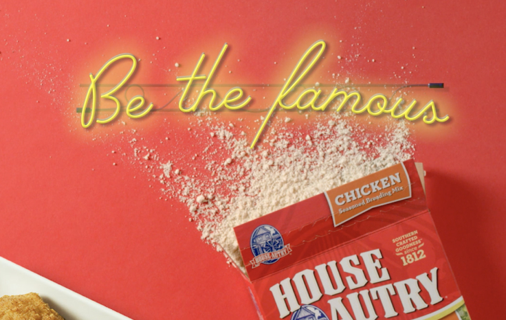 An open box of House Autry seasoning next to a plate of fried chicken