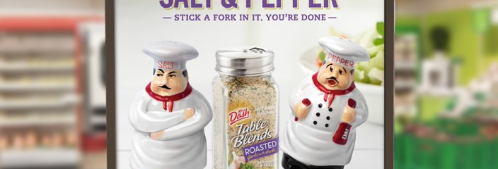 Humanoid salt and pepper shakers with Mrs. Dash seasoning between them