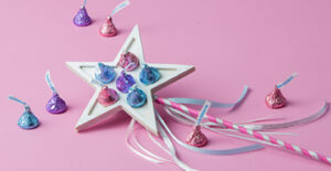 Hershey's Kisses on top of a star-shaped wand