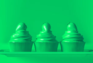 Cupcakes on a tray on a green-filtered background